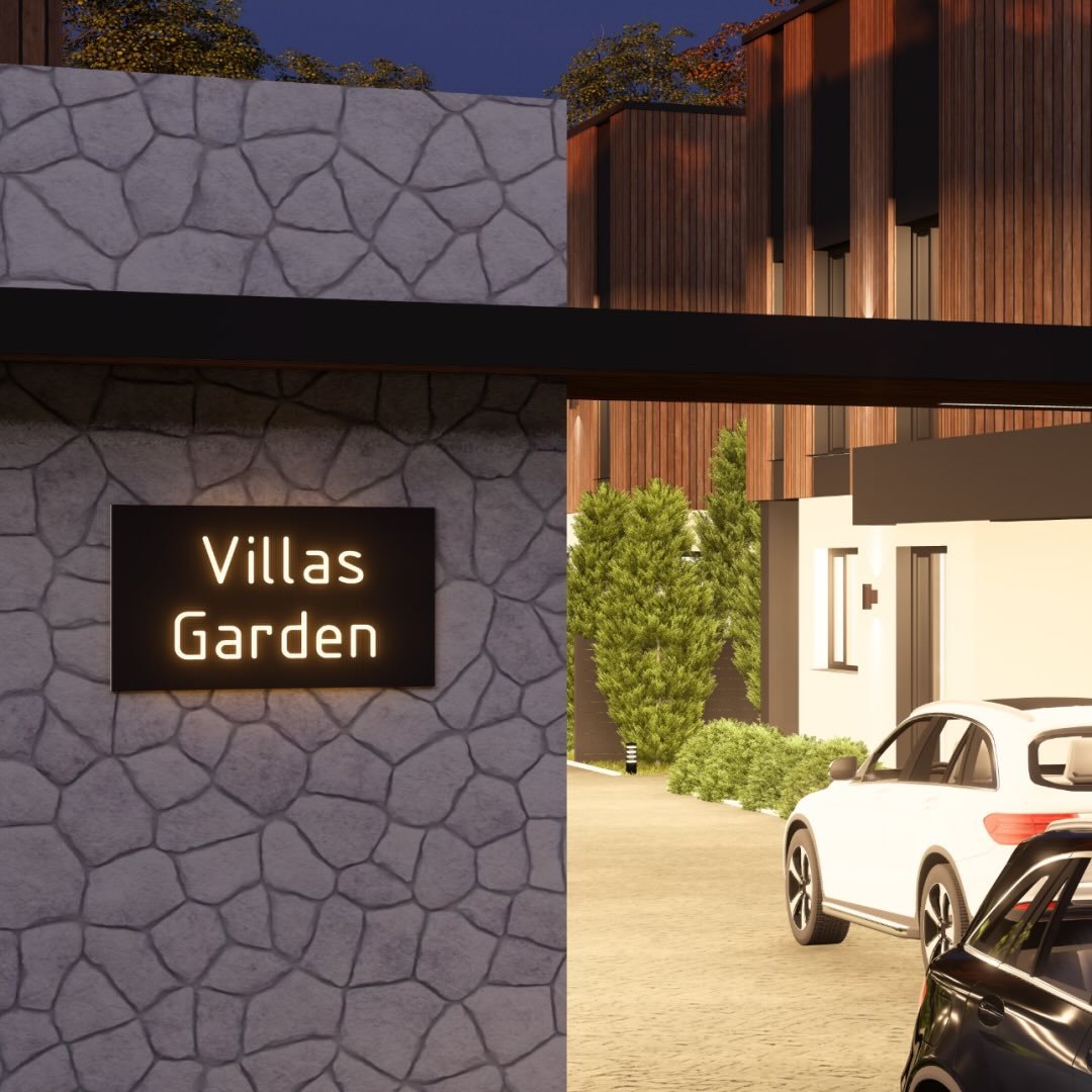 Вхідна група комплексу з підсвіченою вивіскою Villas Garden